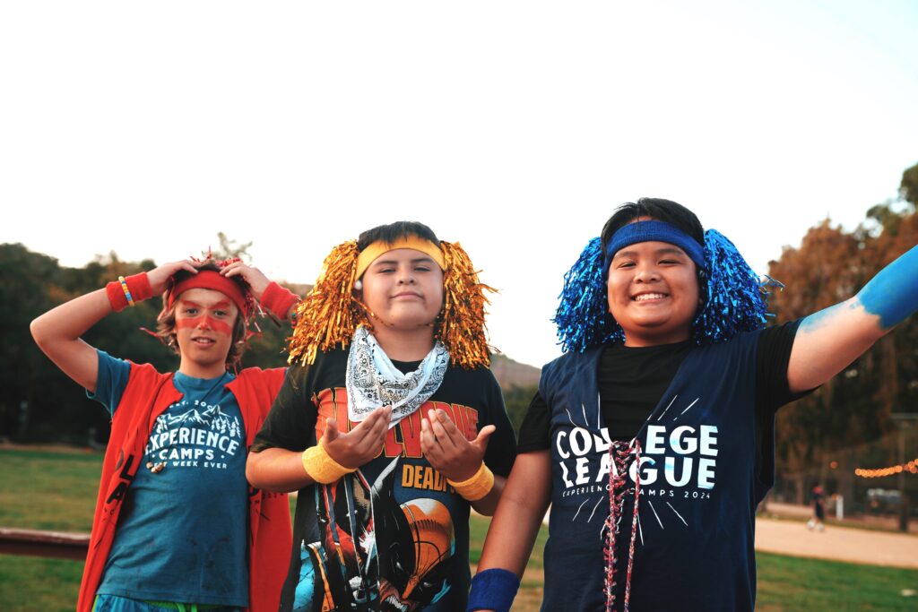 3 male campers dressed in wacky costumes