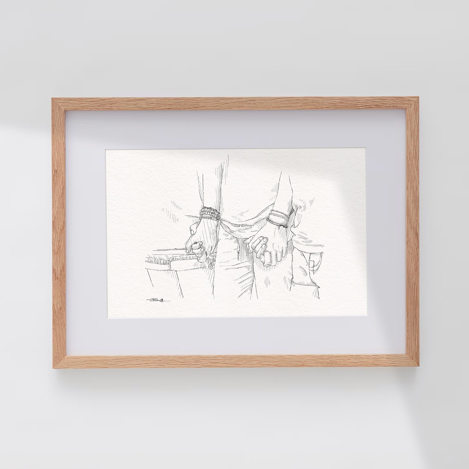 Framed drawing of holding hands